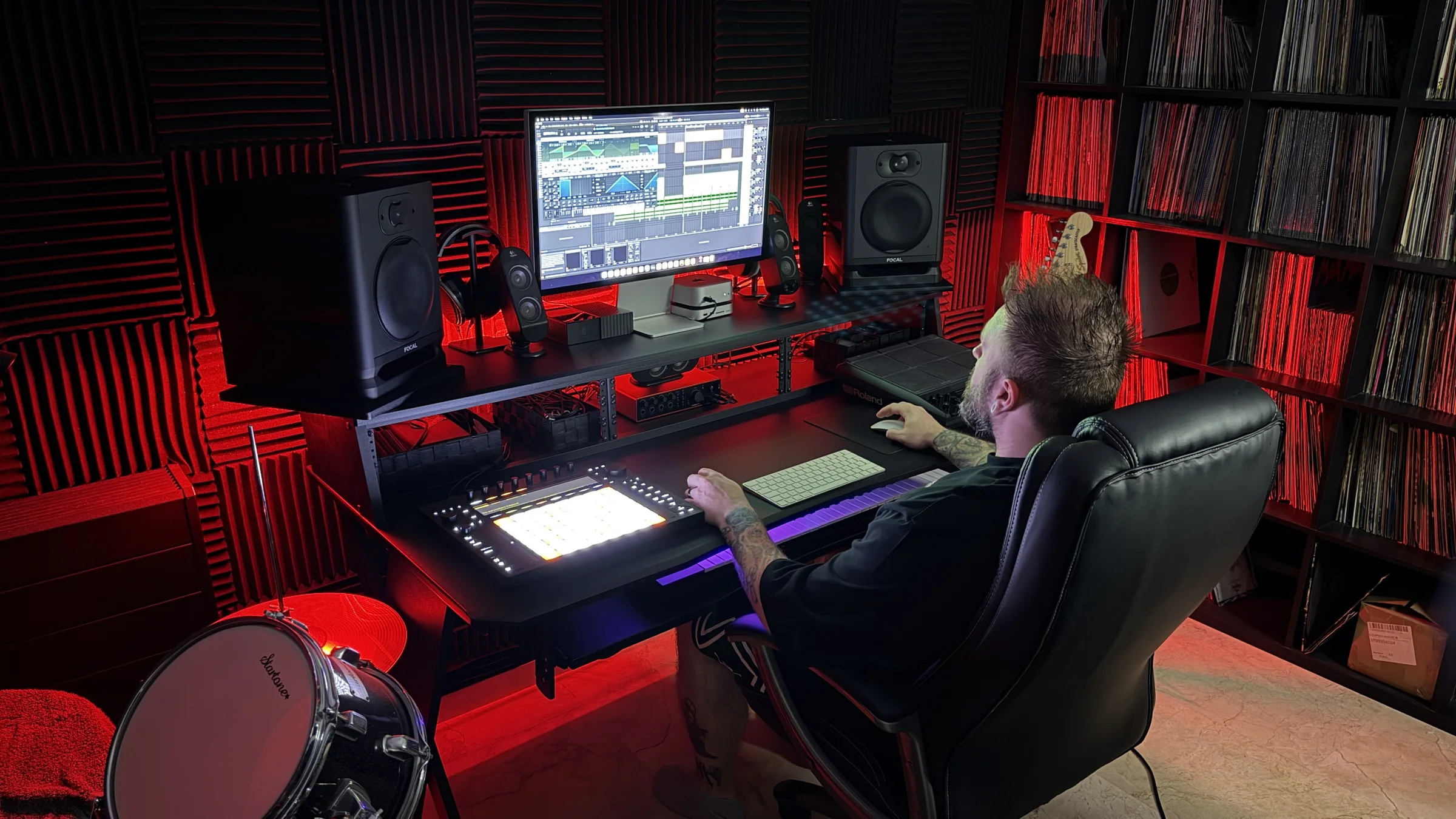 Ash Jenkins working on music at his studio desk.